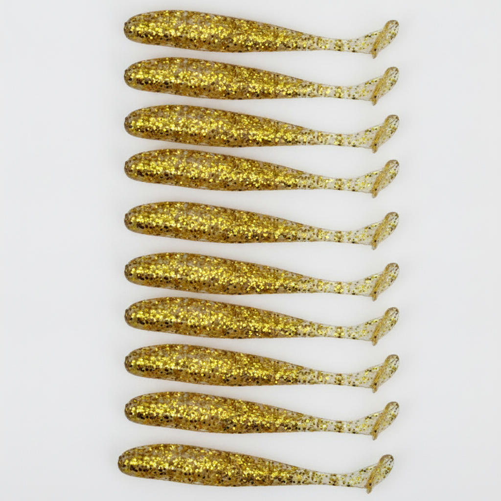Leurre souple à queue en T coloris or pailleté, packshot studio sur fond blanc, lot de 10.