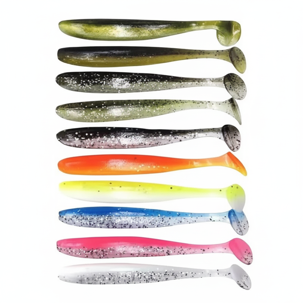 Assortiment de leurres souples à queue en T coloris mélangés, packshot studio sur fond blanc.