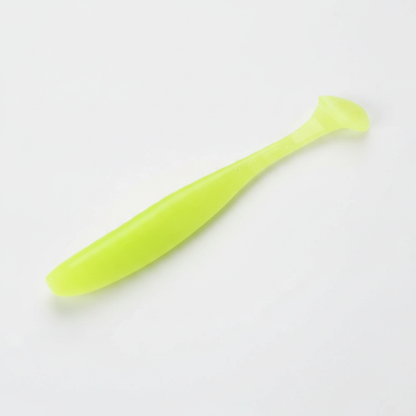 Leurre souple à queue palette coloris chartreuse phosphorescent, packshot studio sur fond blanc.