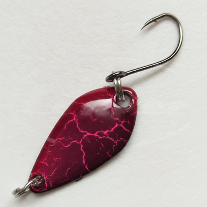 Cuillère ondulante coloris rose cracké, vue studio sur fond blanc