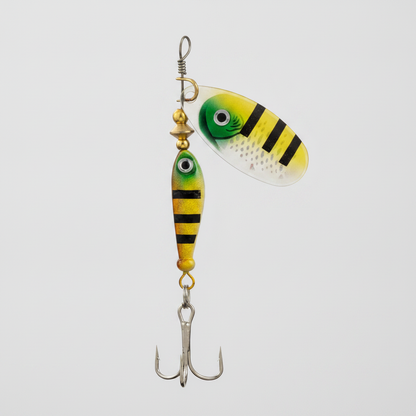 Cuillère LUSHAZER coloris jaune-noir rayé, vue studio sur fond blanc